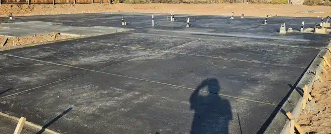 Reinforced concrete foundation slab installation for a 5,500 sq ft custom home in Enchanted Hills, Rio Rancho NM by M&M Concrete.