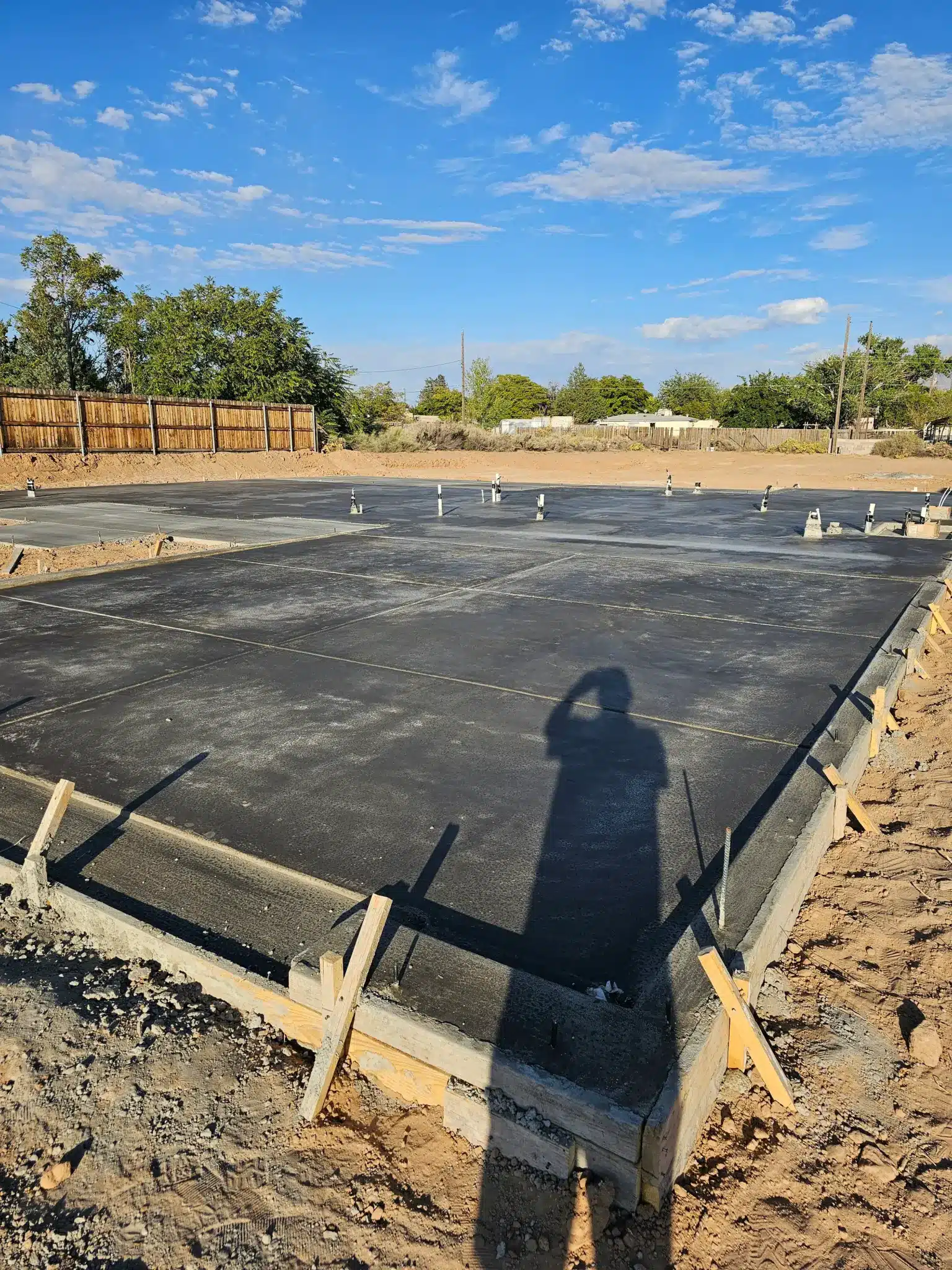 Reinforced concrete foundation slab installation for a 5,500 sq ft custom home in Enchanted Hills, Rio Rancho NM by M&M Concrete.