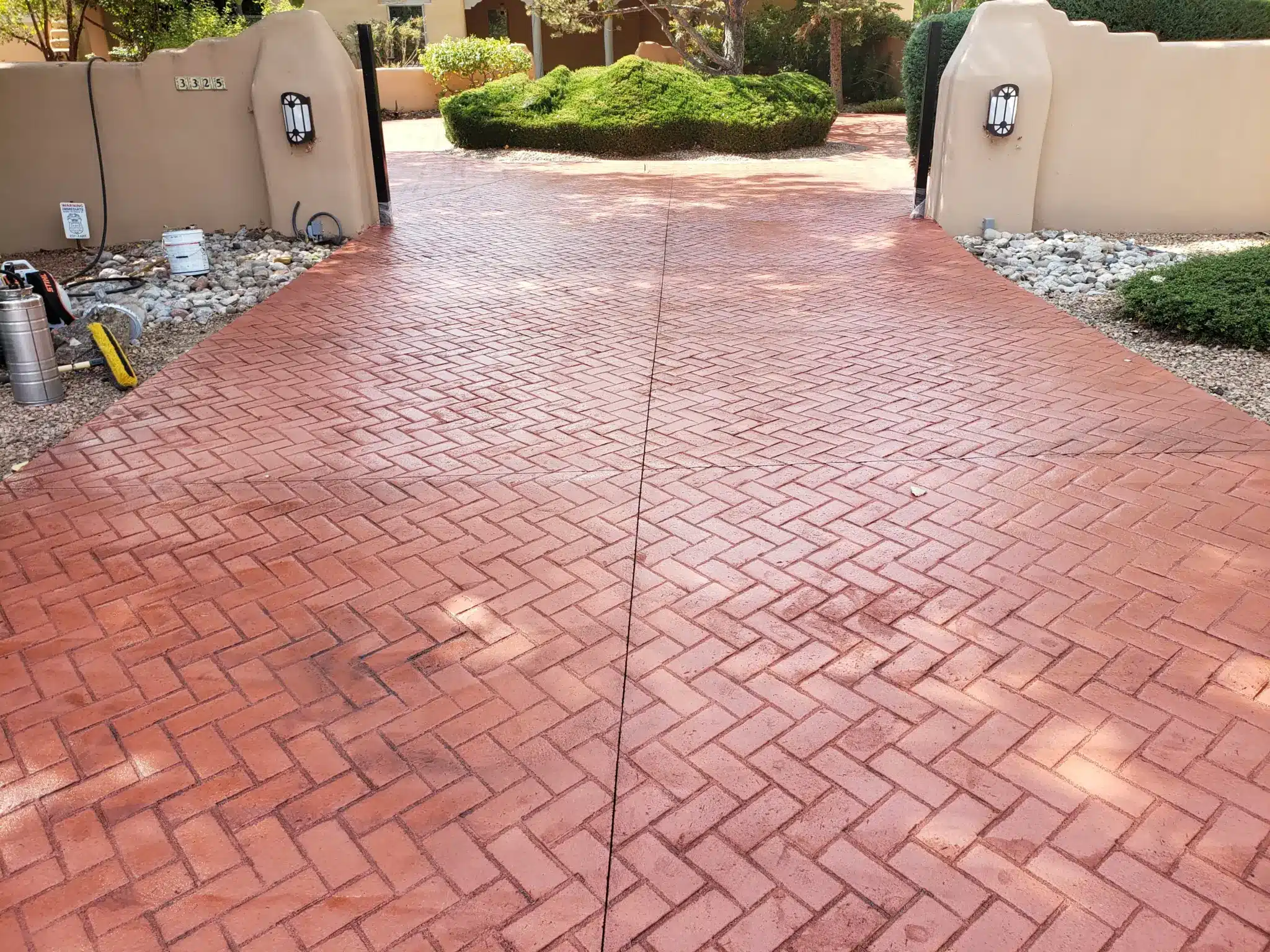 5200 sq ft herringbone brick stamped concrete driveway two tone red gray at Los Ranchos de Albuquerque estate by M&M Concrete