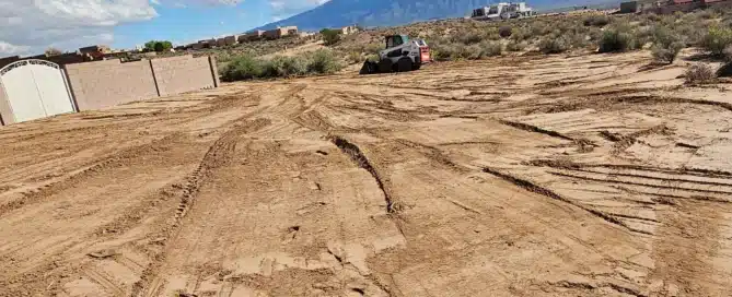 Professional Bobcat and Backhoe services in Albuquerque, showing heavy equipment for site preparation and grading.