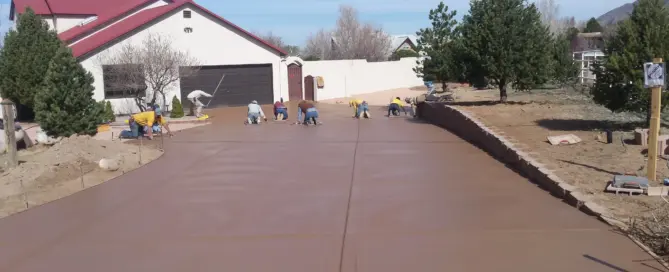 M&M Concrete crew finishing an 11,000 sq ft colored concrete driveway in North Albuquerque Acres, Albuquerque NM