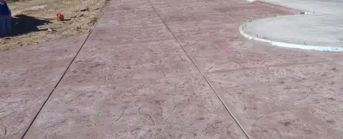 A large 2,800 square foot two-tone stamped concrete patio in the South Valley, Albuquerque, professionally installed by M&M Concrete.