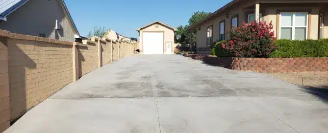 A sprawling, newly poured 4,500 square foot concrete driveway on the side of a home in Rio Rancho, completed by M&M Concrete.