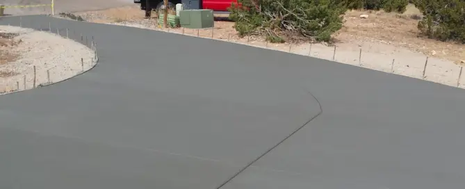 Concrete driveway installation in Placitas NM by M&M Concrete — 5000 sq ft hillside residential driveway