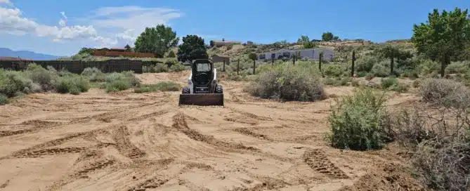 Dirt work Rio Rancho NM — complete backyard landscape removal, regrading and retention pond construction by ABQ Backhoe & Bobcat Services M&M Concrete
