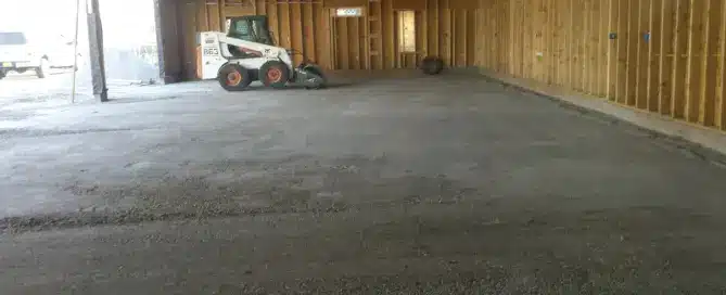 Bobcat vibratory roller compacting sub-grade for a concrete slab foundation in Albuquerque